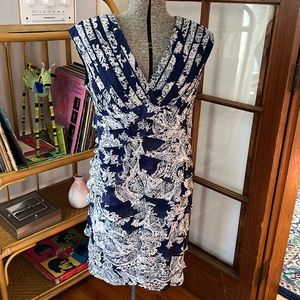 Adrianna Papell blue/white print flutter/ruffle dress. Fitted and stretchy.